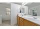 Double sink bathroom vanity with mirror and linen closet at 6382 Lonesome Lake St, Las Vegas, NV 89148