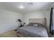 Spacious bedroom with a king-size bed and an exercise bike at 6382 Lonesome Lake St, Las Vegas, NV 89148