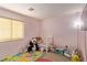 bedroom with crib, toys, and playmat at 6382 Lonesome Lake St, Las Vegas, NV 89148