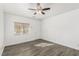 Bright bedroom with contemporary flooring, ceiling fan, and natural light from a window at 6382 Lonesome Lake St, Las Vegas, NV 89148