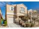 Inviting home showcasing a covered front porch, attached garage, and a well-maintained lawn at 6382 Lonesome Lake St, Las Vegas, NV 89148