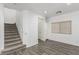 Carpeted staircase in a bright living room with large window at 6382 Lonesome Lake St, Las Vegas, NV 89148