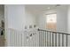 Upstairs landing with railing and window, overlooking the lower level at 6382 Lonesome Lake St, Las Vegas, NV 89148