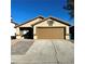 Single-story house with a two-car garage and a paved driveway at 6560 Bush Clover Ln, Las Vegas, NV 89156