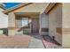 House entrance with brown door, walkway, and landscaping at 6560 Bush Clover Ln, Las Vegas, NV 89156