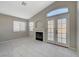 Gathering room with fireplace and French doors leading outside at 6560 Bush Clover Ln, Las Vegas, NV 89156