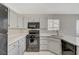 Newly renovated kitchen with corner sink and white cabinets at 6560 Bush Clover Ln, Las Vegas, NV 89156