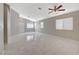 Living room with tile floors, neutral walls, and a ceiling fan at 6560 Bush Clover Ln, Las Vegas, NV 89156