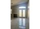 Living room with fireplace and French doors leading outside at 6560 Bush Clover Ln, Las Vegas, NV 89156