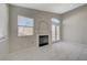 Bright living room with fireplace and tiled floors at 6560 Bush Clover Ln, Las Vegas, NV 89156