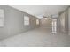 Bright living room with tile floors and ceiling fan at 6560 Bush Clover Ln, Las Vegas, NV 89156