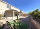 Covered patio with artificial turf and fire pit at 6607 Musette Ave, Las Vegas, NV 89139