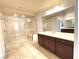 Elegant bathroom featuring a walk-in shower and dark wood cabinets at 6607 Musette Ave, Las Vegas, NV 89139