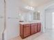 Double vanity bathroom with large mirror at 6607 Musette Ave, Las Vegas, NV 89139