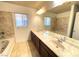 Bathroom boasts double sinks, bathtub, and marble countertops at 6607 Musette Ave, Las Vegas, NV 89139