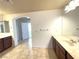 Bright bathroom with double vanities and access to another room at 6607 Musette Ave, Las Vegas, NV 89139