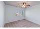 Well-lit bedroom featuring a ceiling fan and window with a view at 6607 Musette Ave, Las Vegas, NV 89139