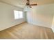 Bright bedroom with ceiling fan and carpet flooring at 6607 Musette Ave, Las Vegas, NV 89139