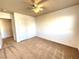 Spacious bedroom with ceiling fan and large closet at 6607 Musette Ave, Las Vegas, NV 89139