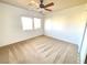 Spacious bedroom with a ceiling fan and carpet flooring at 6607 Musette Ave, Las Vegas, NV 89139