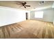 Bright bedroom with ceiling fan and carpet at 6607 Musette Ave, Las Vegas, NV 89139