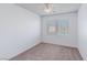 Bright bedroom with ceiling fan and neutral carpeting at 6607 Musette Ave, Las Vegas, NV 89139