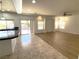 Kitchen with granite island and sliding door to backyard at 6607 Musette Ave, Las Vegas, NV 89139