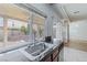 Kitchen sink with granite countertop and view of backyard at 6607 Musette Ave, Las Vegas, NV 89139