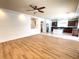 Open living room, hardwood floors and kitchen view at 6607 Musette Ave, Las Vegas, NV 89139