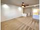 Bright loft area featuring neutral carpet and ceiling fan at 6607 Musette Ave, Las Vegas, NV 89139