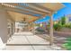 Covered patio with ceiling fan and adjacent lawn at 6607 Musette Ave, Las Vegas, NV 89139