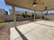 Covered patio with ceiling fans and artificial turf at 6607 Musette Ave, Las Vegas, NV 89139