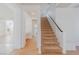 Beige carpeted staircase with simple railing at 6607 Musette Ave, Las Vegas, NV 89139