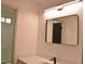 Bathroom with vanity, large mirror, and modern lighting at 7409 Flat Rock St, Las Vegas, NV 89131