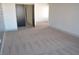 Bright bedroom with carpeted floor and neutral wall color at 7409 Flat Rock St, Las Vegas, NV 89131