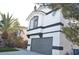 Two-story house with gray garage and white accents at 7409 Flat Rock St, Las Vegas, NV 89131