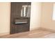 Modern electric fireplace with dark tile surround at 7409 Flat Rock St, Las Vegas, NV 89131