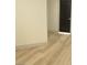 Clean hallway with light wood-look flooring at 7409 Flat Rock St, Las Vegas, NV 89131