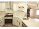 Modern kitchen with stainless steel appliances and white cabinets at 7409 Flat Rock St, Las Vegas, NV 89131