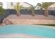 Relaxing pool with stone accents and palm trees at 7409 Flat Rock St, Las Vegas, NV 89131