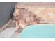 Serene waterfall feature flows into pool at 7409 Flat Rock St, Las Vegas, NV 89131