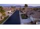 Aerial view of a residential street with mountain backdrop at 750 Arguello Cir, Mesquite, NV 89027