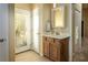 Bathroom featuring vanity with a vessel sink and a door to the exterior at 750 Arguello Cir, Mesquite, NV 89027