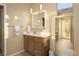 Bathroom with wood vanity, large mirror, and tile flooring at 750 Arguello Cir, Mesquite, NV 89027