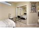 Small bedroom with a twin bed and mirrored closet doors at 750 Arguello Cir, Mesquite, NV 89027