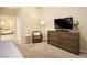 Bedroom with dresser, armchair, and view of the bathroom at 750 Arguello Cir, Mesquite, NV 89027