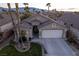 Single-story house with two-car garage and landscaping at 750 Arguello Cir, Mesquite, NV 89027