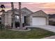 Single-story house with two-car garage and landscaping at 750 Arguello Cir, Mesquite, NV 89027