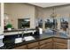 Eat-in kitchen with granite counters, double sink, and backyard view at 750 Arguello Cir, Mesquite, NV 89027