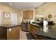 Spacious kitchen featuring granite countertops and ample wood cabinetry at 750 Arguello Cir, Mesquite, NV 89027